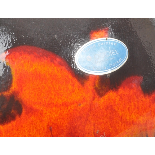 31 - Poole Pottery - A forest flame purse table top vase, together with matching pattern large wall / dis... 