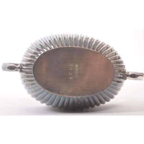 33 - Art Deco early 20th century silver plate tea service set. Comprising of hot water jug, teapot and tw... 