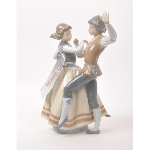 34 - Lladro - Late 20th century Spanish porcelain figure. Hand painted muted colourway tones to the glaze... 