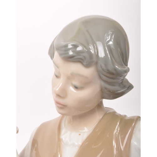 34 - Lladro - Late 20th century Spanish porcelain figure. Hand painted muted colourway tones to the glaze... 