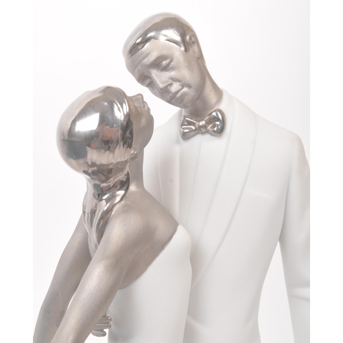 35 - Lladro - A Lladro Happy Anniversary (Feliz Aniversario) Re-Deco porcelain figure. The figure depicti... 