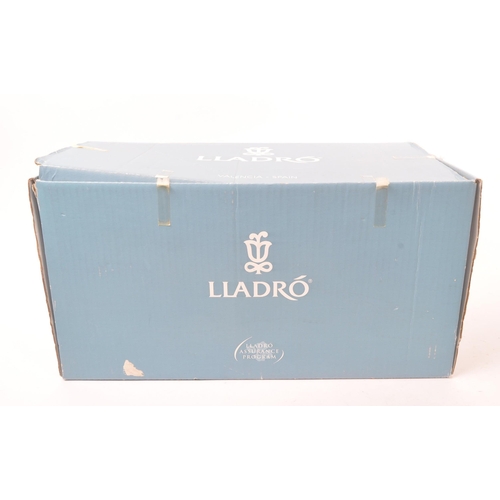 35 - Lladro - A Lladro Happy Anniversary (Feliz Aniversario) Re-Deco porcelain figure. The figure depicti... 