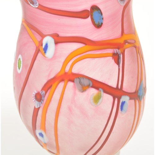 38 - A set of three 20th century studio art glass hand blown stemmed glasses. Each glass raised on a roun... 