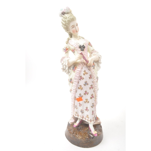 39 - A pair of 20th century Meissen manner German Continental porcelain figures. The figures, one of a la... 