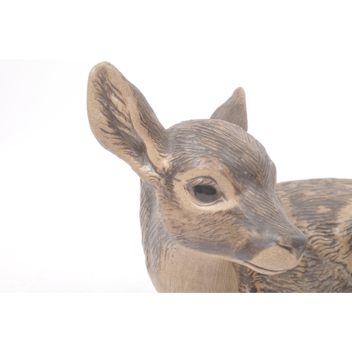 41 - Poole pottery - 20th century - A large hand made figure of a fawn and two smaller figure badgers wit... 
