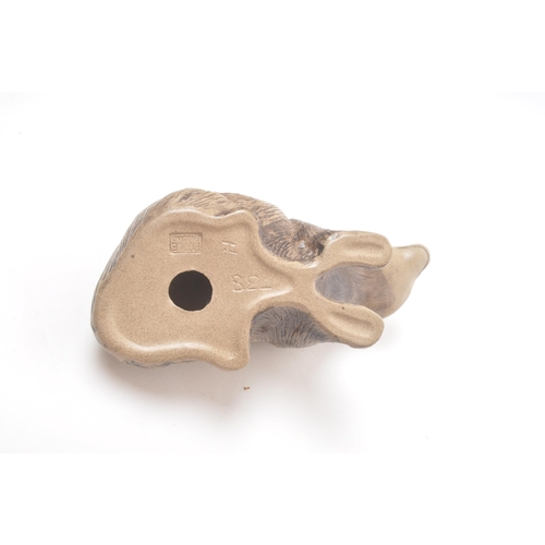 41 - Poole pottery - 20th century - A large hand made figure of a fawn and two smaller figure badgers wit... 