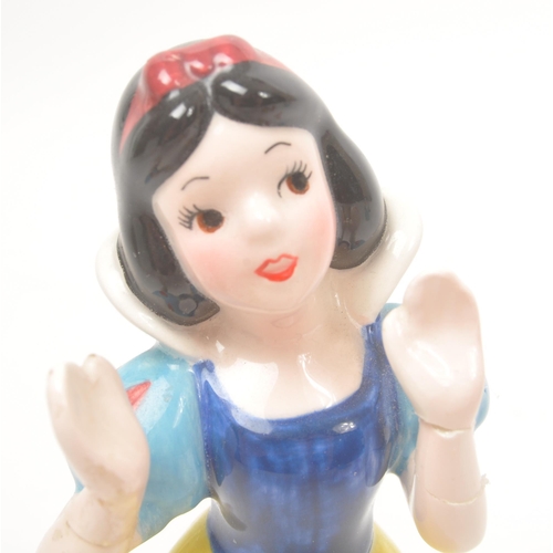 42 - Disney - 20th Century - A collection of ceramic, hand painted Disney figurines in the form of Cinder... 