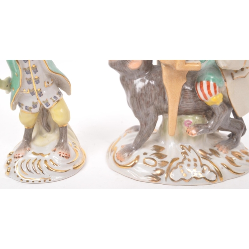 47 - Two 20th century Meissen manner porcelain monkey figures. One figure depicting a monkey stood, with ... 