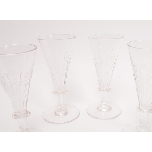 5 - George III 19th century four drinking / display glasses. With conical tapering reeded bowl into a si... 
