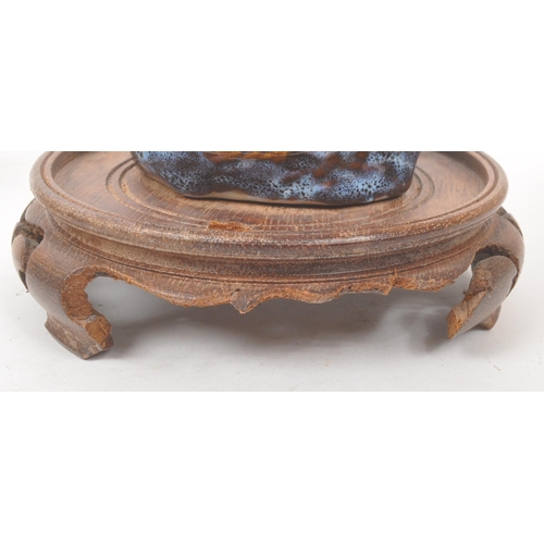 50 - A collection of four Chinese ceramic mud men figurines. Each of the figures on naturalistic bases, w... 