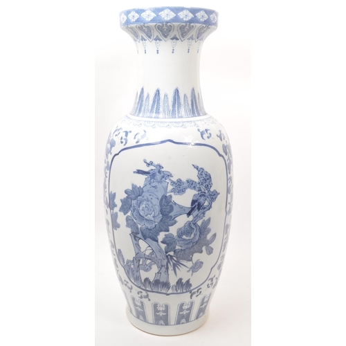 57 - A large Chinese floor standing vase. The vase having a rounded base with tapered rounded body, and n... 