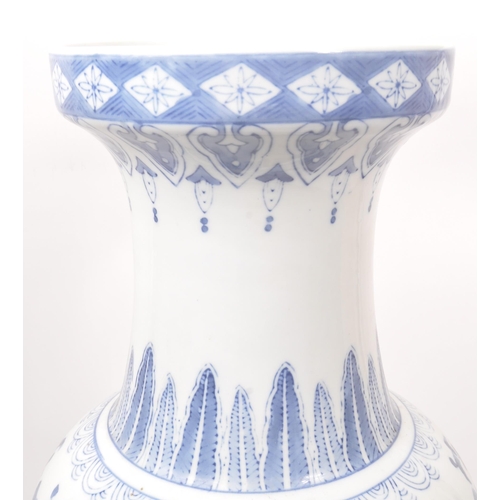 57 - A large Chinese floor standing vase. The vase having a rounded base with tapered rounded body, and n... 