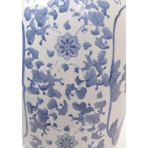 57 - A large Chinese floor standing vase. The vase having a rounded base with tapered rounded body, and n... 