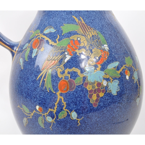 9 - A large 20th century Crown Pottery Bursley Ware Selah pattern jug. The jug having blue glaze with pa... 