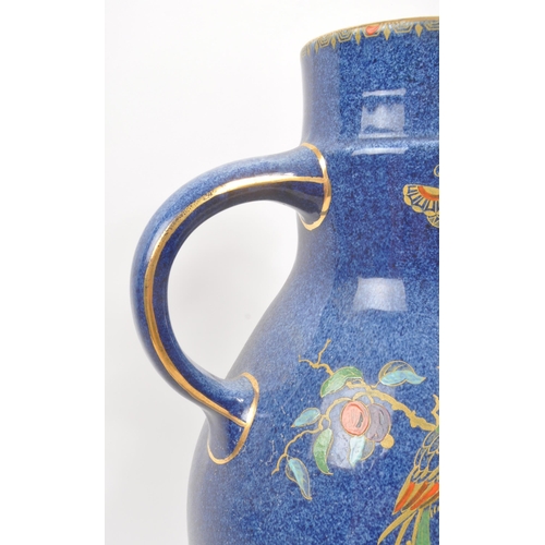 9 - A large 20th century Crown Pottery Bursley Ware Selah pattern jug. The jug having blue glaze with pa... 