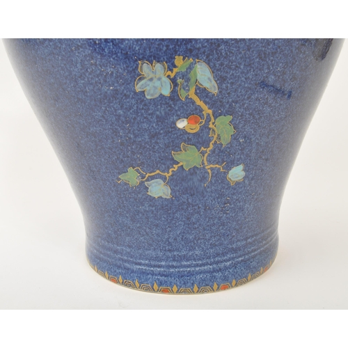 9 - A large 20th century Crown Pottery Bursley Ware Selah pattern jug. The jug having blue glaze with pa... 