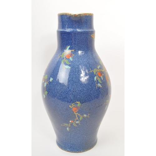 9 - A large 20th century Crown Pottery Bursley Ware Selah pattern jug. The jug having blue glaze with pa... 