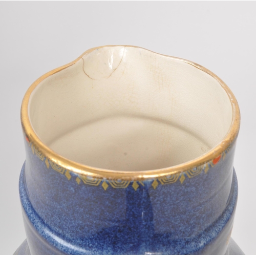 9 - A large 20th century Crown Pottery Bursley Ware Selah pattern jug. The jug having blue glaze with pa... 