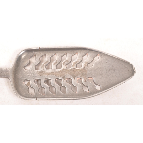 45a - A late 19th century French white metal absinthe spoon. The spoon having a pierced basin with a handl... 