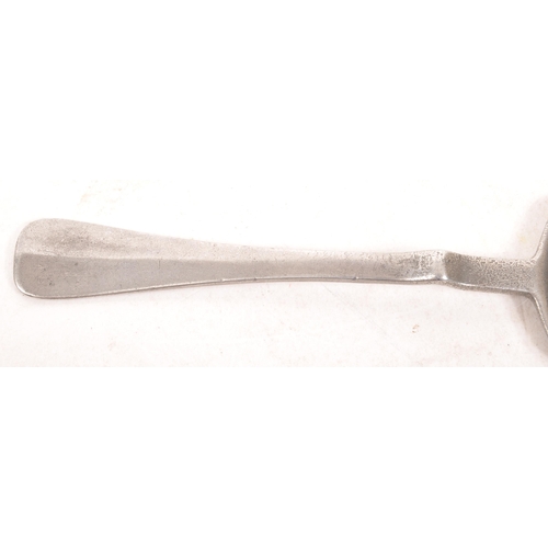 45a - A late 19th century French white metal absinthe spoon. The spoon having a pierced basin with a handl... 