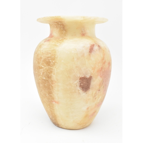 100 - A Egyptian late 19th century alabaster vase. The vase having a baluster shaped body with flat everte... 