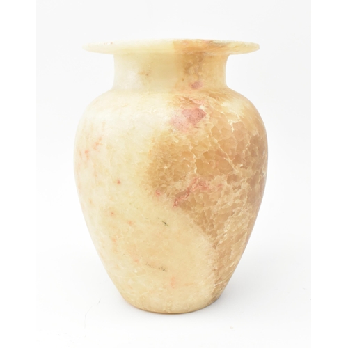 100 - A Egyptian late 19th century alabaster vase. The vase having a baluster shaped body with flat everte... 