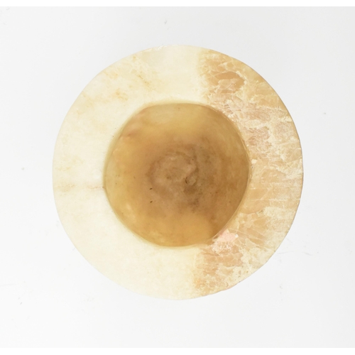 100 - A Egyptian late 19th century alabaster vase. The vase having a baluster shaped body with flat everte... 