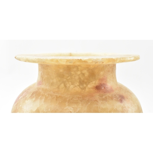 100 - A Egyptian late 19th century alabaster vase. The vase having a baluster shaped body with flat everte... 
