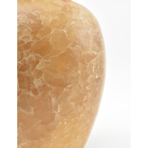 100 - A Egyptian late 19th century alabaster vase. The vase having a baluster shaped body with flat everte... 