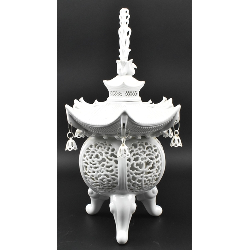 104 - A Chinese Qing Dynasty late 19th / early 20th century blanc de chine glazed ceramic pagoda tripod in... 