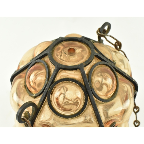 108 - A French inspired early 20th century amber hand blown glass bubble porch lantern light. The lantern ... 
