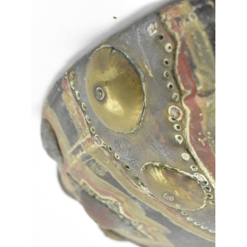 113 - A North Indian early 20th century brass & copper on wood circular shield dhal. The shield having a d... 