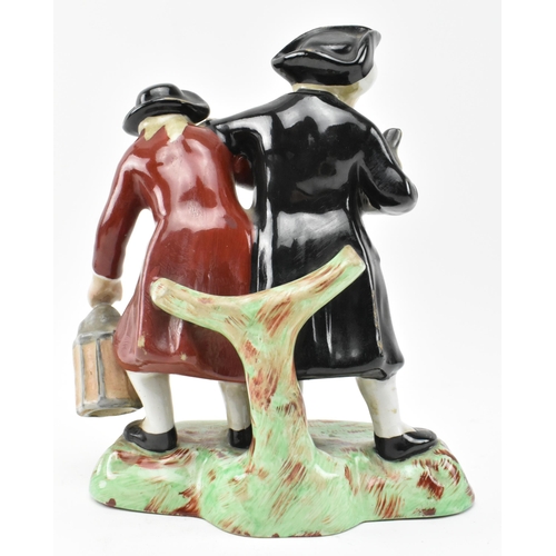 114 - A Victorian 19th century Staffordshire pottery figural group of ' The Parson and Clerk '. The figure... 