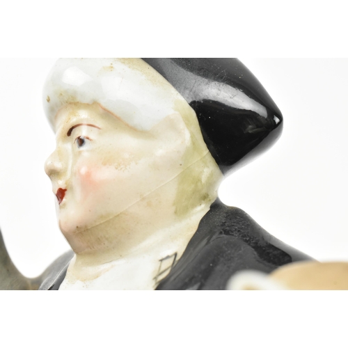 114 - A Victorian 19th century Staffordshire pottery figural group of ' The Parson and Clerk '. The figure... 