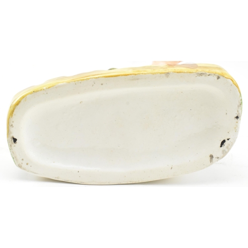 115 - A Victorian late 19th century circa 1880s Staffordshire spill holder vase. The vase in the form of t... 