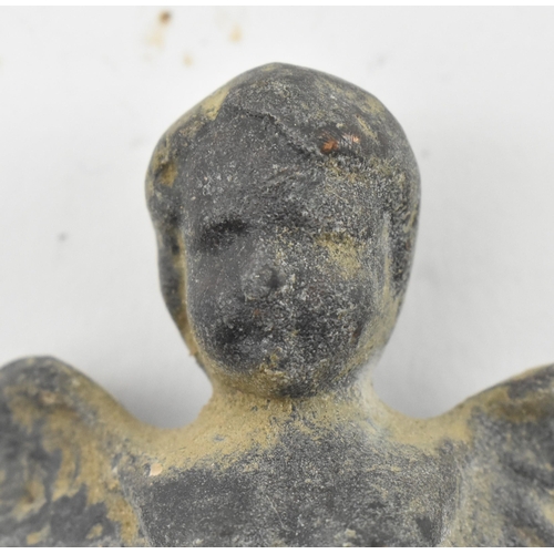117 - A believed Ancient Roman circa 2nd century cherub figurine. The idol figure with twin wings, raised ... 