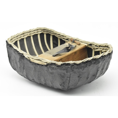 62 - A mid 20th century 1957 Welsh presentation model coracle boat, presented to Megan Lloyd George M.P..... 