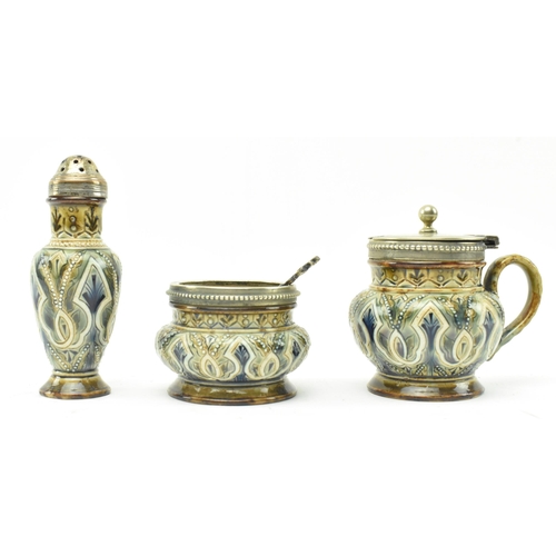 63 - Doulton Lambeth - a Victorian late 19th century circa 1883 stoneware glazed ceramic cruet set. The s... 