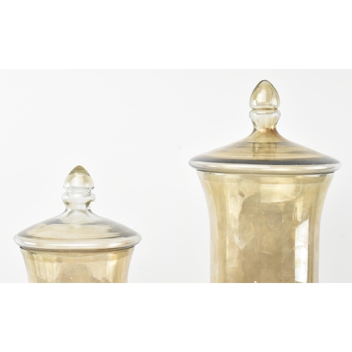 64 - A pair of early 20th century circa 1900 lustre glass confectionery shop display lidded vases / jars.... 