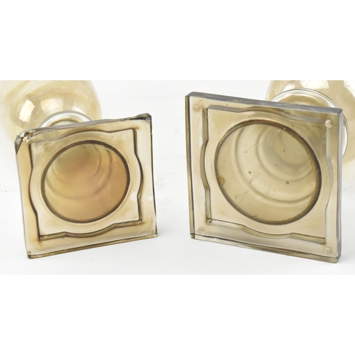 64 - A pair of early 20th century circa 1900 lustre glass confectionery shop display lidded vases / jars.... 
