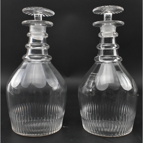 72 - A pair of George III early 19th century circa 1820 cut glass decanters. Each decanter decorated with... 