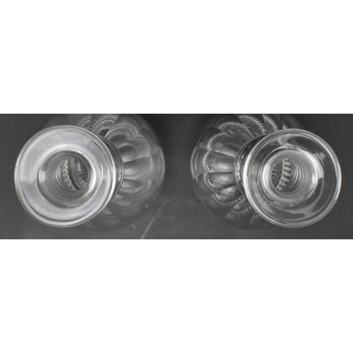 72 - A pair of George III early 19th century circa 1820 cut glass decanters. Each decanter decorated with... 