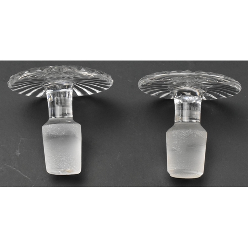 72 - A pair of George III early 19th century circa 1820 cut glass decanters. Each decanter decorated with... 