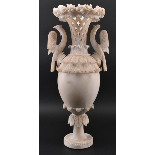 78 - A late 19th / early 20th century cream alabaster mantle piece vase. The vase having an intricately c... 