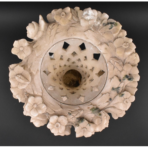 78 - A late 19th / early 20th century cream alabaster mantle piece vase. The vase having an intricately c... 