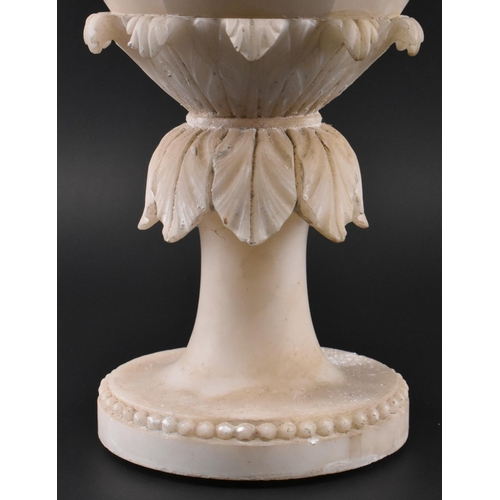 78 - A late 19th / early 20th century cream alabaster mantle piece vase. The vase having an intricately c... 