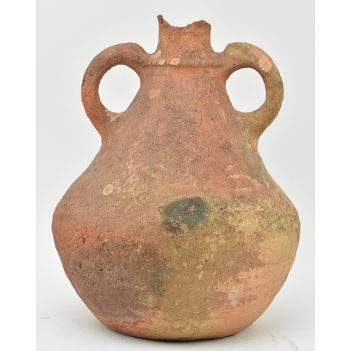 85 - A Mesopotamia large Roman / North African/ Greek/ terracotta storage amphora. The bulbous shaped bod... 