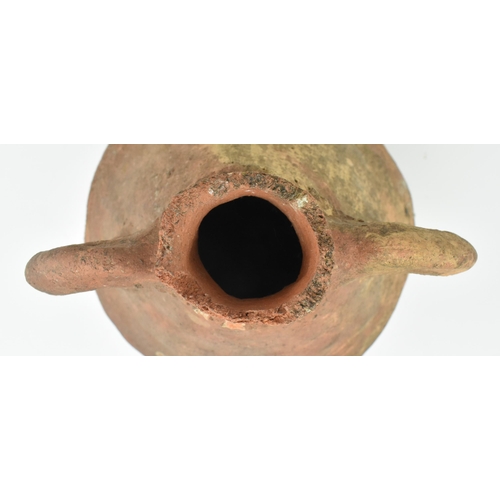 85 - A Mesopotamia large Roman / North African/ Greek/ terracotta storage amphora. The bulbous shaped bod... 