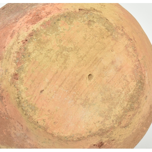 85 - A Mesopotamia large Roman / North African/ Greek/ terracotta storage amphora. The bulbous shaped bod... 