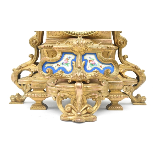 86 - A French late 19th - early 20th century gilt metal two train mantel clock. The mantle clock featurin... 